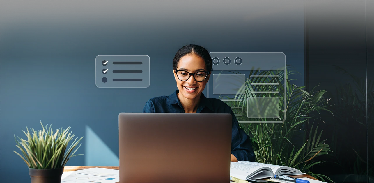 A woman typing on a laptop