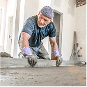 Image of man screeding concrete